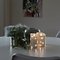 Konstsmide LED real wax candle 10x14 cm with decoration light chain white